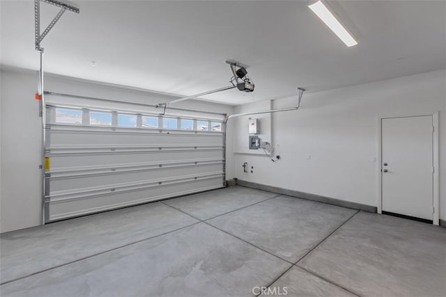 30773 Vera Cruz Cir, Winchester, CA 92596 - garage featuring a garage door opener and baseboards