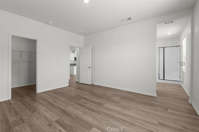 30773 Vera Cruz Cir, Winchester, CA 92596 - unfurnished bedroom featuring a spacious closet, wood finished floors, and a closet