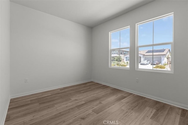 30773 Vera Cruz Cir, Winchester, CA 92596 - unfurnished room with light wood-style flooring and baseboards