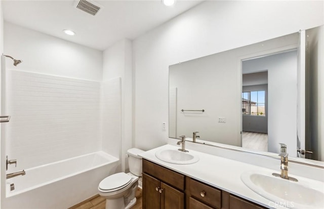 4180 Larchwood Ln, Lake Elsinore, CA 92530 - full bathroom featuring toilet, wood finished floors, double vanity, tub / shower combination, and recessed lighting
