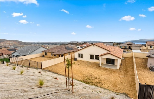 4180 Larchwood Ln, Lake Elsinore, CA 92530 - rear view of property with a residential view, stucco siding, a fenced backyard, and a mountain view