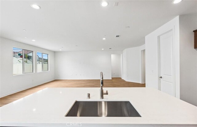 4180 Larchwood Ln, Lake Elsinore, CA 92530 - kitchen with a sink, open floor plan, light countertops, and recessed lighting