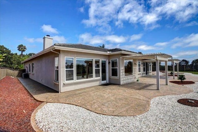 508 Hidden Ridge Ct, Encinitas, CA 92024 - rear view of house featuring a pergola, a chimney, a patio, and stucco siding