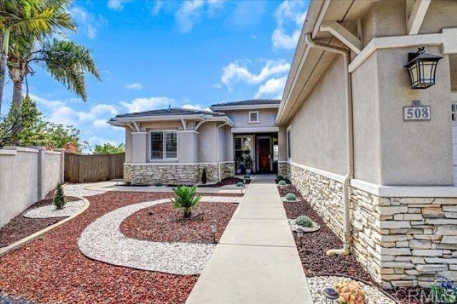 508 Hidden Ridge Ct, Encinitas, CA 92024 - view of exterior entry with stone siding and stucco siding