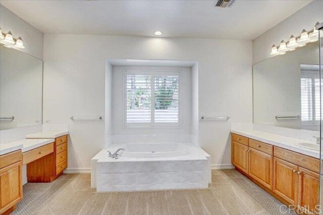 508 Hidden Ridge Ct, Encinitas, CA 92024 - full bathroom with healthy amount of natural light, two vanities, a garden tub, and recessed lighting