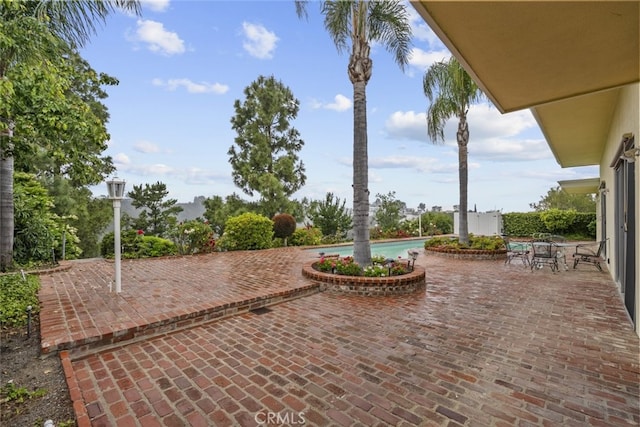 10835 Savona Rd, Los Angeles, CA 90077 - view of patio with an outdoor pool and outdoor dining area