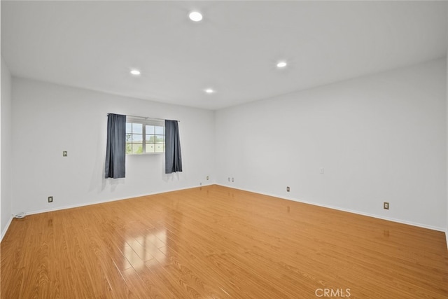 10835 Savona Rd, Los Angeles, CA 90077 - empty room featuring light wood finished floors, recessed lighting, and baseboards
