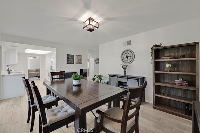 23706 Mill Valley Rd, Valencia, CA 91355 - dining room featuring light wood-style flooring and ceiling fan