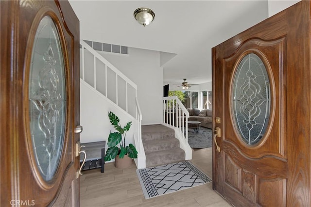 23706 Mill Valley Rd, Valencia, CA 91355 - entryway with stairs, ceiling fan, and light wood finished floors