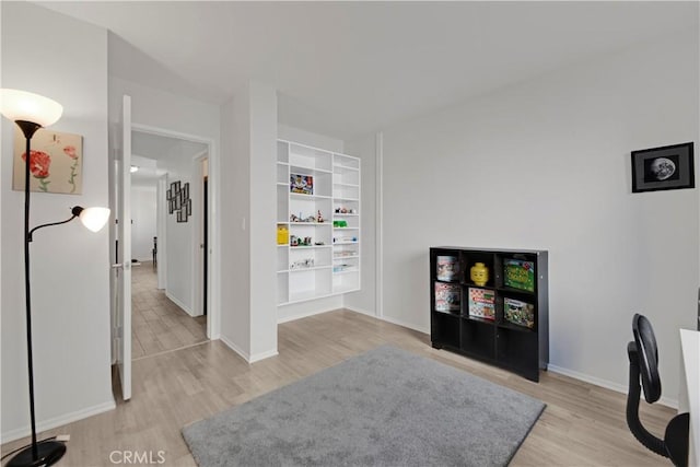 23706 Mill Valley Rd, Valencia, CA 91355 - home office with light wood-type flooring and baseboards