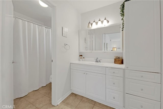 23706 Mill Valley Rd, Valencia, CA 91355 - full bathroom with tile patterned flooring, vanity, toilet, and baseboards