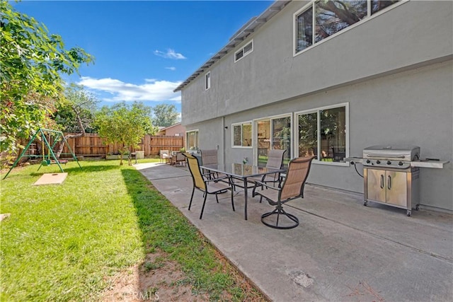 23706 Mill Valley Rd, Valencia, CA 91355 - view of patio / terrace with grilling area and a playground