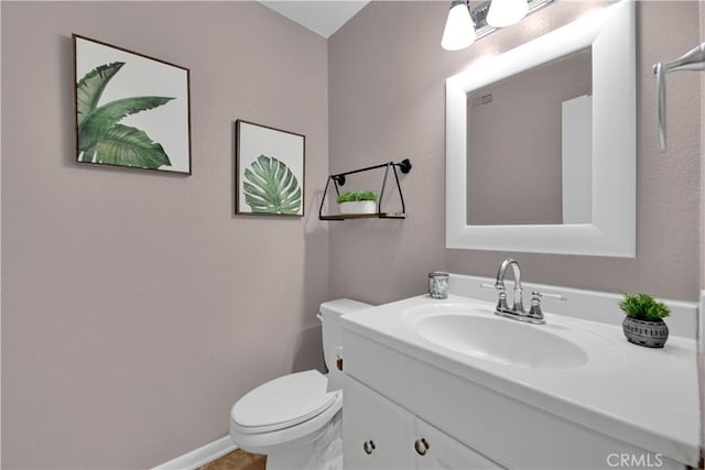 23706 Mill Valley Rd, Valencia, CA 91355 - half bath featuring toilet, vanity, and baseboards