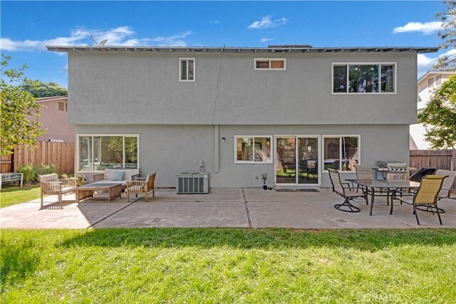 23706 Mill Valley Rd, Valencia, CA 91355 - back of house featuring an outdoor living space, stucco siding, a patio, and central air condition unit