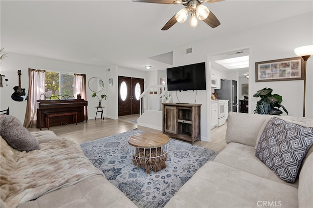 23706 Mill Valley Rd, Valencia, CA 91355 - living room with a ceiling fan, light wood-type flooring, and baseboards