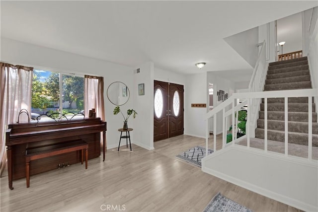 23706 Mill Valley Rd, Valencia, CA 91355 - entrance foyer featuring stairway, wood finished floors, and baseboards