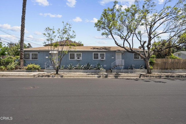 ranch-style home with stucco siding