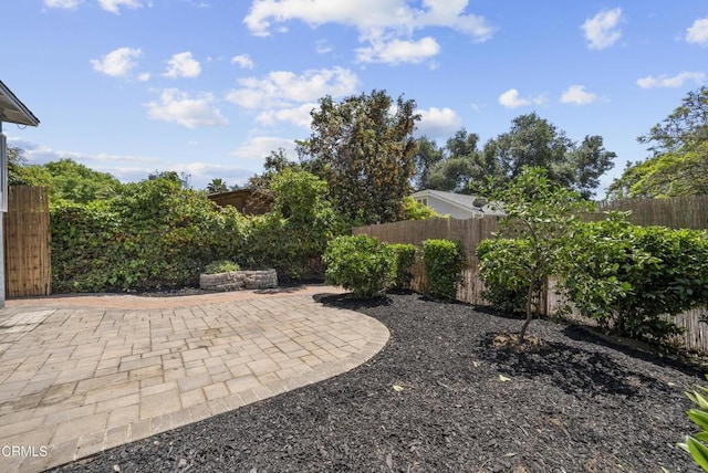 fenced backyard with a patio