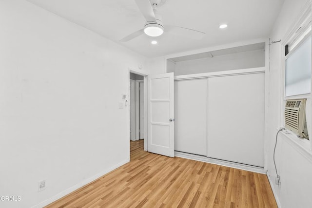 unfurnished bedroom featuring wood finished floors, a closet, recessed lighting, ceiling fan, and baseboards