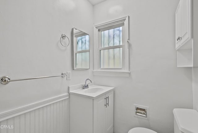 bathroom with toilet and vanity