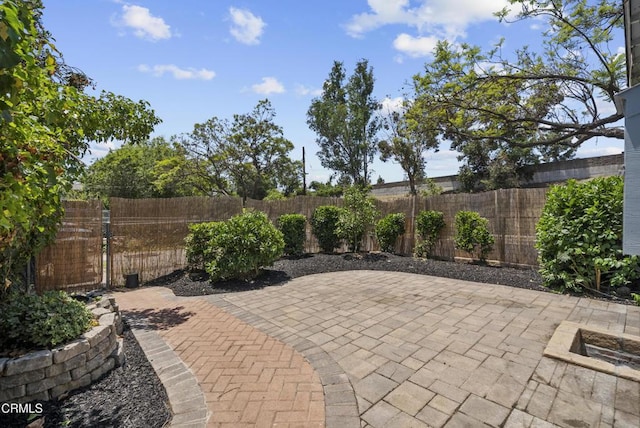 fenced backyard with a patio area
