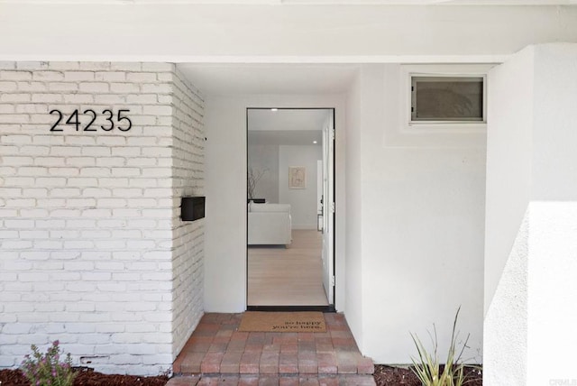 24235 Via Aquara Ave, Laguna Niguel, CA 92677 - property entrance featuring brick siding and stucco siding