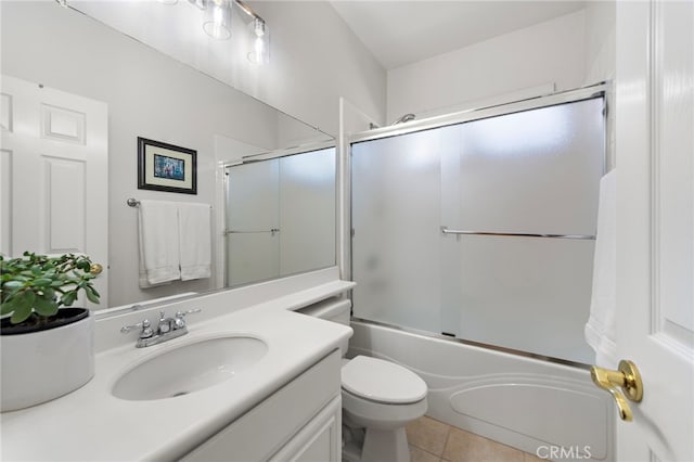 43 Flintridge, Ladera Ranch, CA 92694 - bathroom featuring toilet, vanity, tile patterned flooring, and combined bath / shower with glass door
