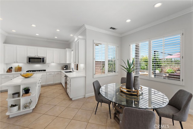 43 Flintridge, Ladera Ranch, CA 92694 - kitchen with stainless steel microwave, a sink, open shelves, light tile patterned flooring, and light countertops