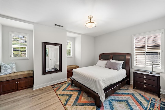 43 Flintridge, Ladera Ranch, CA 92694 - bedroom with multiple windows, light wood-style flooring, and baseboards