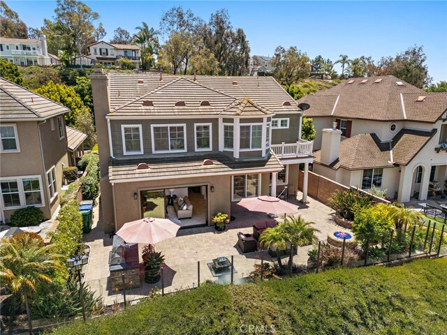 43 Flintridge, Ladera Ranch, CA 92694 - rear view of house featuring a patio, a residential view, a tile roof, and stucco siding