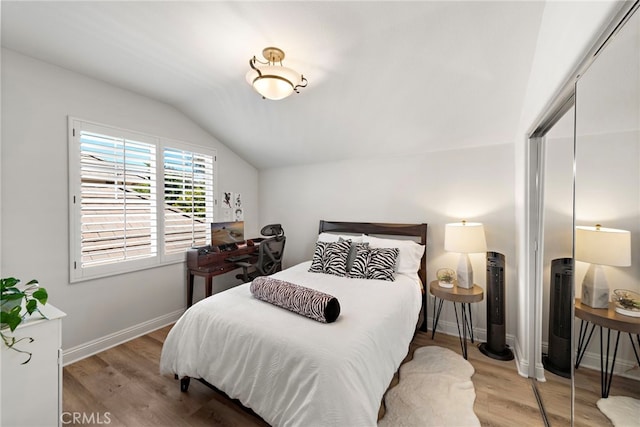 43 Flintridge, Ladera Ranch, CA 92694 - bedroom featuring lofted ceiling, wood finished floors, a closet, and baseboards