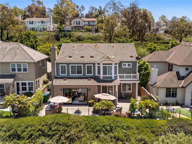 43 Flintridge, Ladera Ranch, CA 92694 - rear view of house featuring a residential view, a patio, a tile roof, and stucco siding