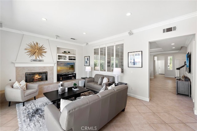 43 Flintridge, Ladera Ranch, CA 92694 - living room featuring light tile patterned floors, crown molding, a premium fireplace, recessed lighting, and baseboards