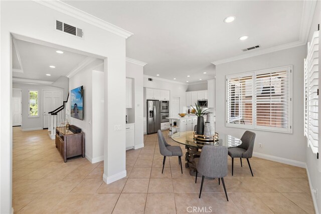 43 Flintridge, Ladera Ranch, CA 92694 - dining area featuring recessed lighting, light tile patterned floors, crown molding, baseboards, and stairs