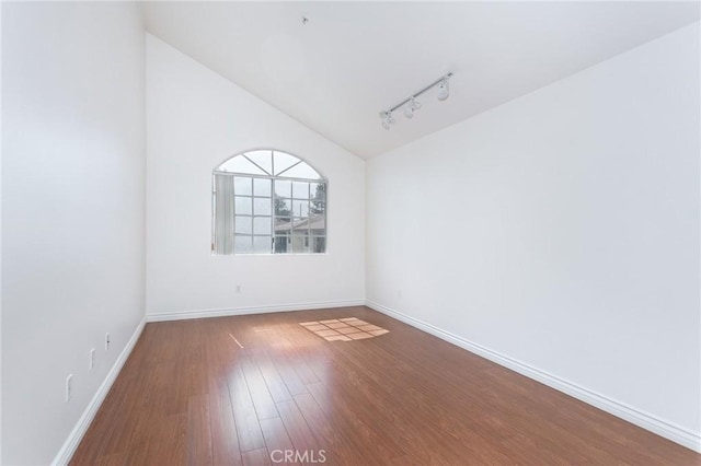 18 Fano St Unit 2, Arcadia, CA 91006 - unfurnished room featuring rail lighting, lofted ceiling, wood finished floors, and baseboards