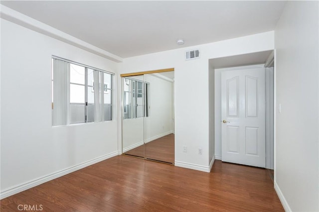 18 Fano St Unit 2, Arcadia, CA 91006 - unfurnished bedroom featuring wood finished floors, a closet, and baseboards