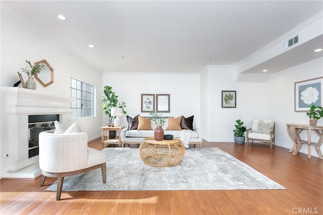 18 Fano St Unit 2, Arcadia, CA 91006 - living area featuring wood finished floors, crown molding, baseboards, a glass covered fireplace, and recessed lighting