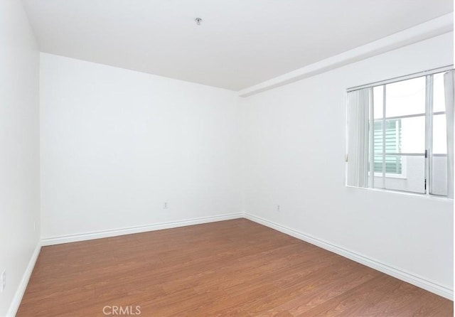18 Fano St Unit 2, Arcadia, CA 91006 - empty room featuring wood finished floors, baseboards, and a pendent fire sprinkler