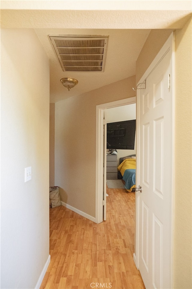 310 Buena Vista Ct, Merced, CA 95348 - hallway with light wood finished floors and baseboards