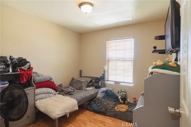 310 Buena Vista Ct, Merced, CA 95348 - bedroom with multiple windows and wood finished floors