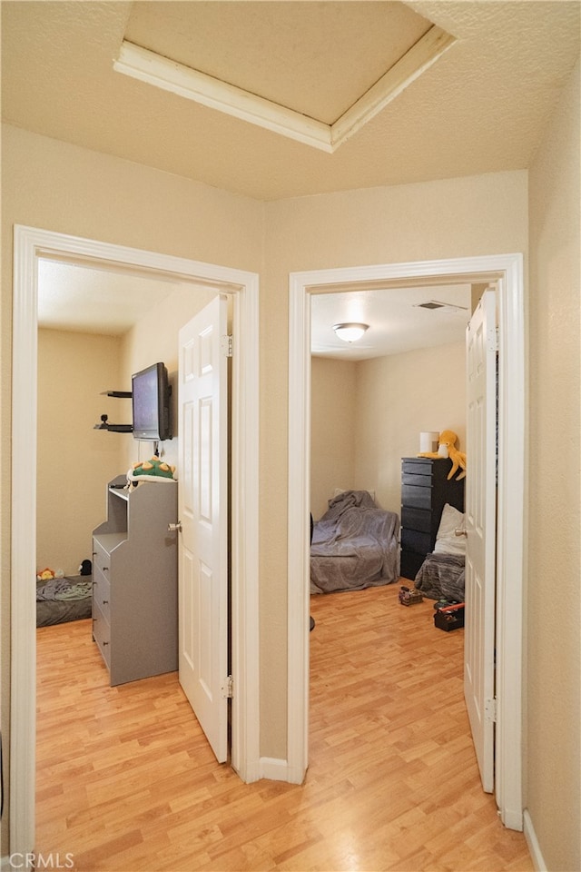 310 Buena Vista Ct, Merced, CA 95348 - hallway featuring light wood-style flooring and baseboards