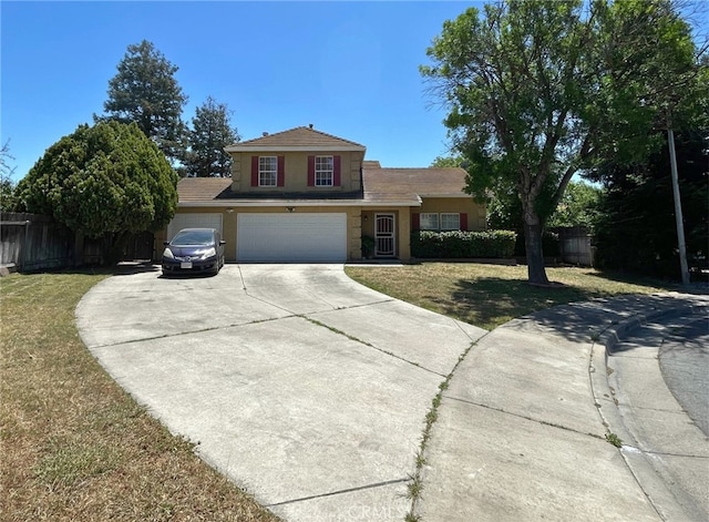 310 Buena Vista Ct, Merced, CA 95348 - traditional-style home featuring stucco siding, driveway, and a garage