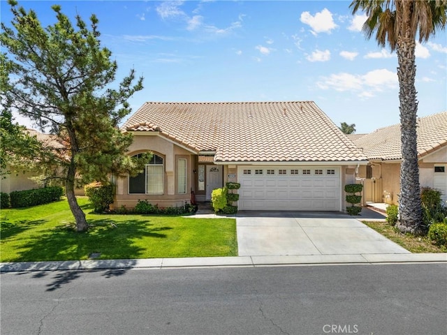 4856 W Glen Abbey Way, Banning, CA 92220 - view of front of property featuring a tiled roof, a garage, concrete driveway, and stucco siding