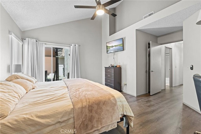 4856 W Glen Abbey Way, Banning, CA 92220 - bedroom featuring wood finished floors, a textured ceiling, a ceiling fan, baseboards, and high vaulted ceiling