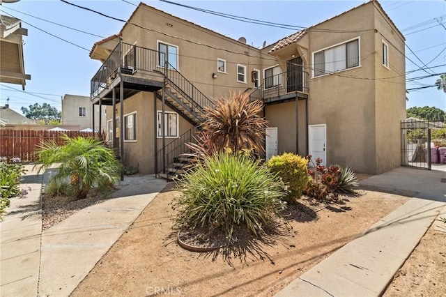 915 Cherry Ave, Long Beach, CA 90813 - view of front of home with stucco siding and stairway