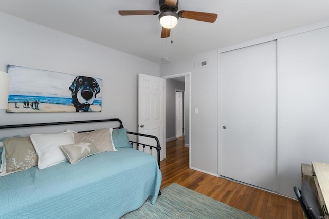 3696 Ben St, San Diego, CA 92111 - bedroom with wood finished floors, a closet, a ceiling fan, and baseboards