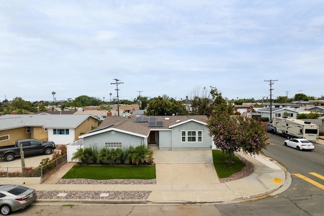 3696 Ben St, San Diego, CA 92111 - ranch-style home with solar panels, a residential view, driveway, and stucco siding