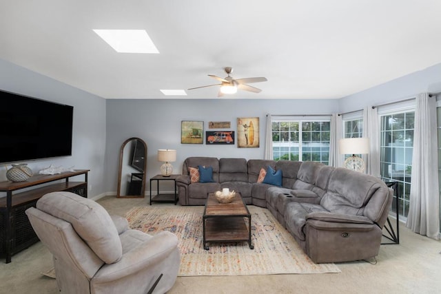 3696 Ben St, San Diego, CA 92111 - carpeted living area featuring a skylight, ceiling fan, and baseboards