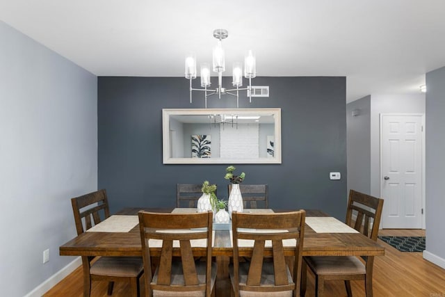 3696 Ben St, San Diego, CA 92111 - dining room with a chandelier, wood finished floors, and baseboards