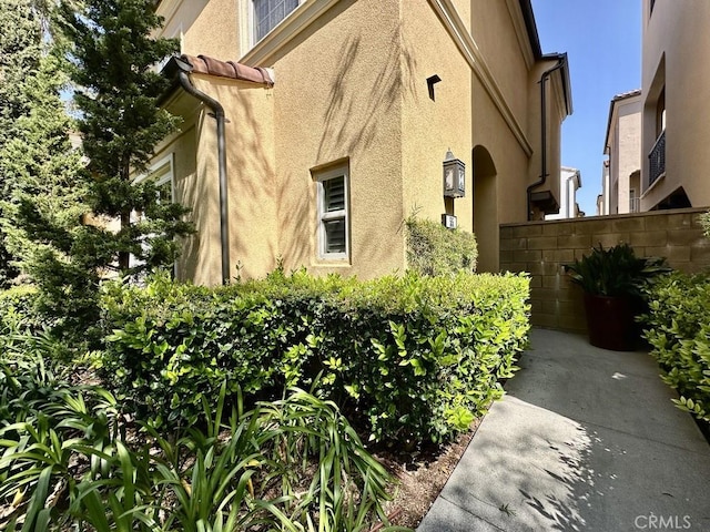 view of home's exterior with stucco siding